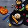 kids halloween party food with pumpkin risotto frankfurters background wallpaper