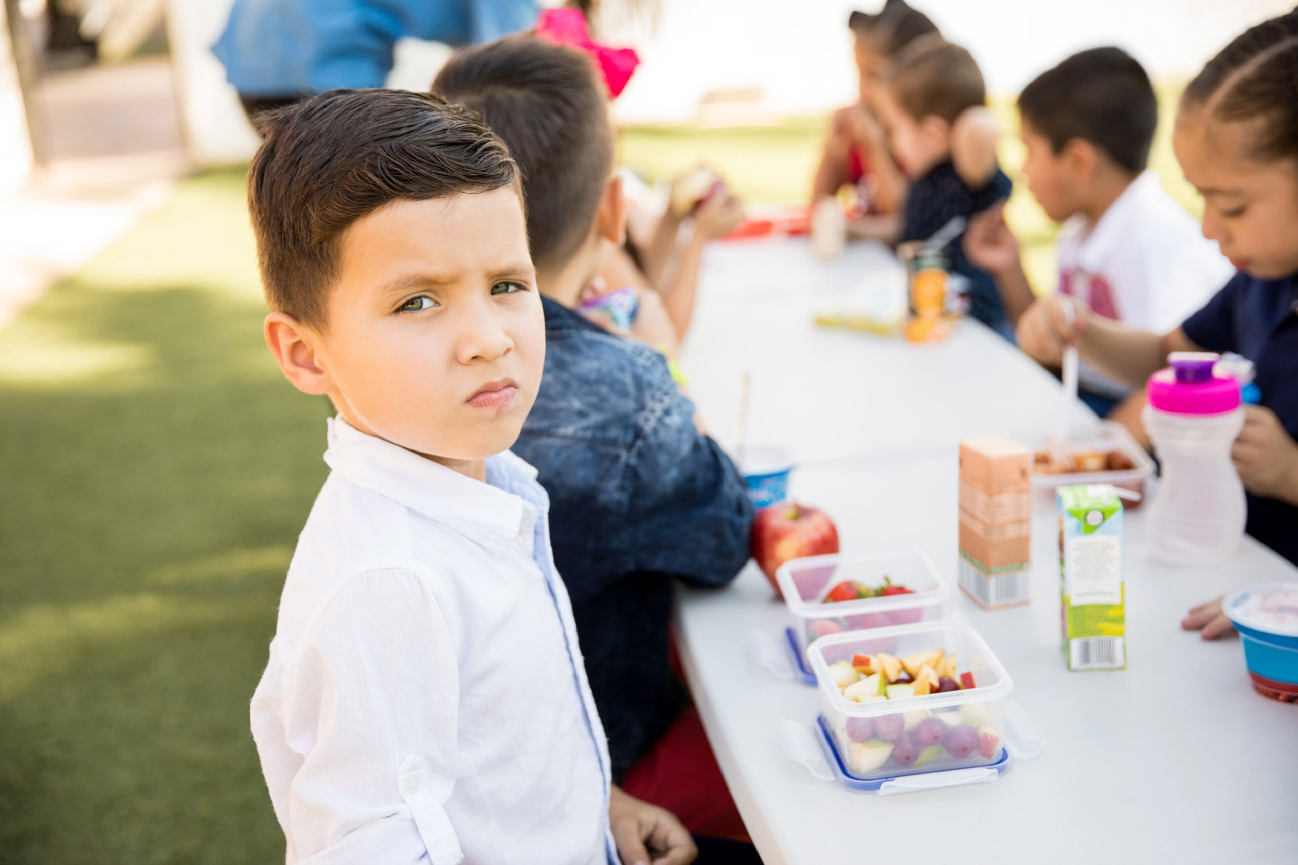 portrait good looking hispanic preschool student eating healthy food his lunch break scaled