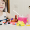 lovely girl painting egg with violet